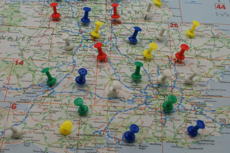 A map marked with various coloured push pins indicating locations.